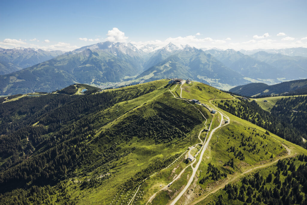 Green Schmittenhöhe with hiking trails and mountain panorama